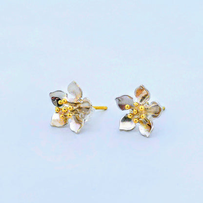 Flower earrings with red gold pins.